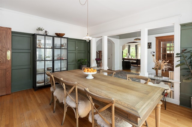 305 Park Hill Ave, Yonkers, NY 10705 - dining space with arched walkways and light wood-style flooring