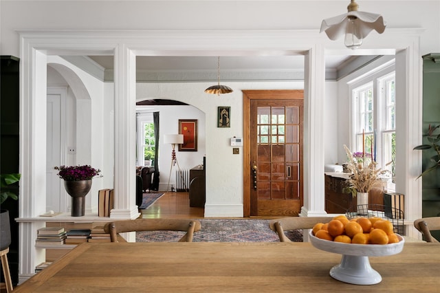 305 Park Hill Ave, Yonkers, NY 10705 - entrance foyer with arched walkways, crown molding, wood finished floors, radiator heating unit, and ceiling fan