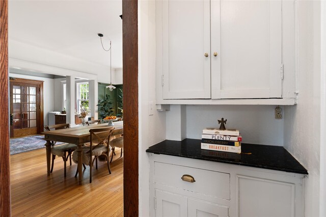 305 Park Hill Ave, Yonkers, NY 10705 - kitchen with light wood-style floors, white cabinetry, and french doors