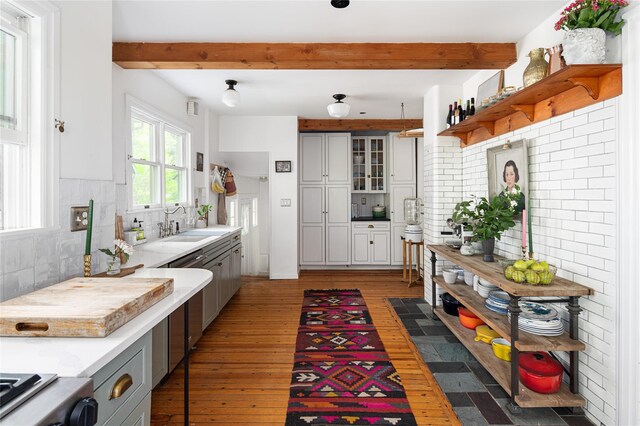 305 Park Hill Ave, Yonkers, NY 10705 - kitchen with backsplash, hardwood / wood-style floors, beamed ceiling, open shelves, and light countertops