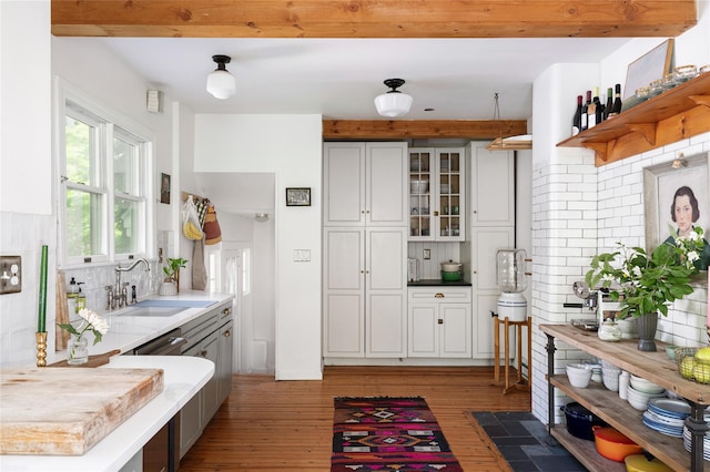 305 Park Hill Ave, Yonkers, NY 10705 - kitchen with tasteful backsplash, open shelves, light wood-style floors, and white cabinetry