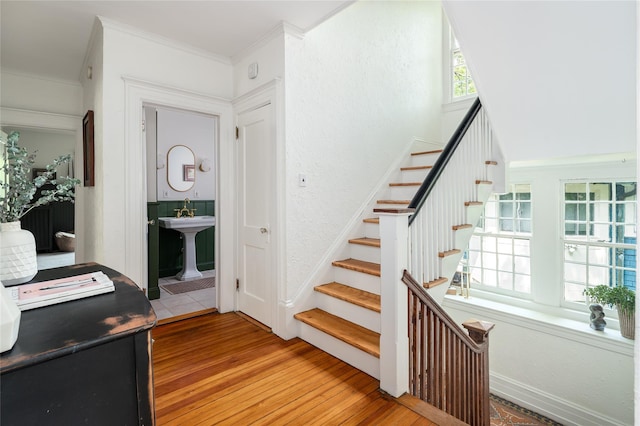 305 Park Hill Ave, Yonkers, NY 10705 - staircase featuring hardwood / wood-style flooring and ornamental molding