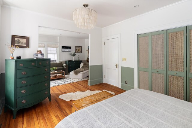 305 Park Hill Ave, Yonkers, NY 10705 - bedroom with hardwood / wood-style floors, crown molding, and a chandelier