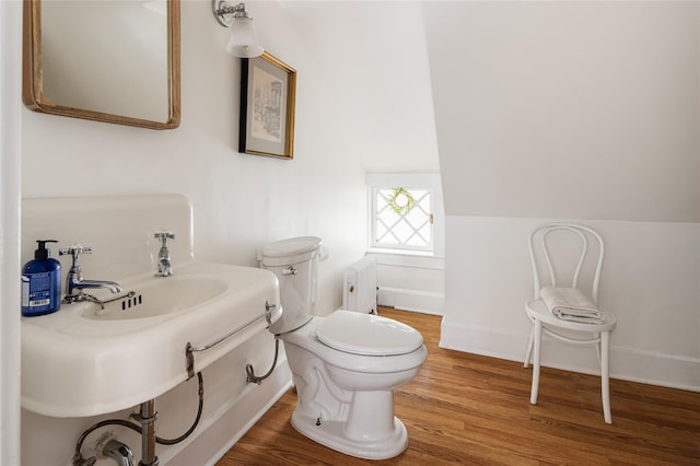 305 Park Hill Ave, Yonkers, NY 10705 - bathroom with radiator heating unit and wood finished floors