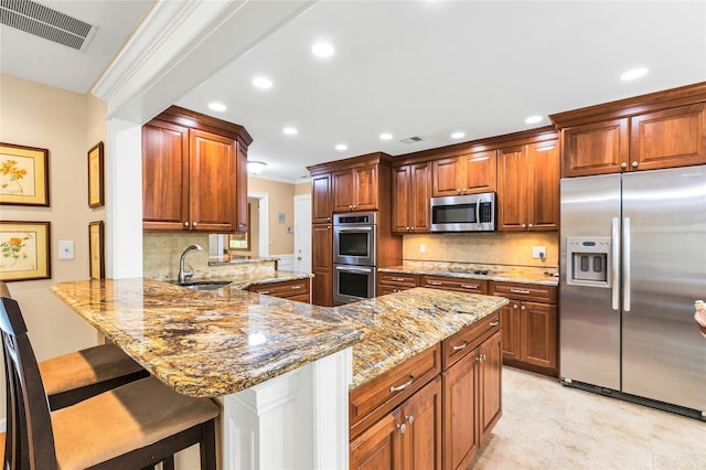 82 Harbour Ln, Bay Shore, NY 11706 - kitchen featuring stainless steel appliances, decorative backsplash, recessed lighting, a peninsula, and light stone counters