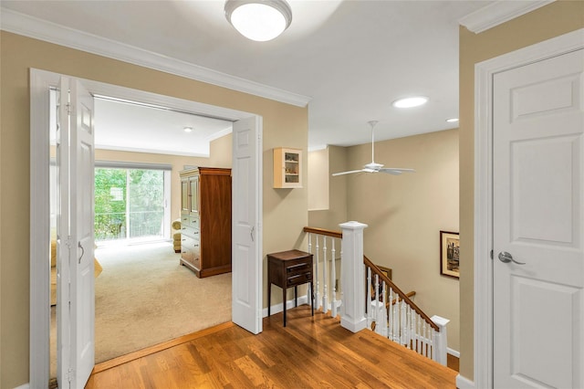 82 Harbour Ln, Bay Shore, NY 11706 - hallway featuring an upstairs landing, wood finished floors, crown molding, and recessed lighting