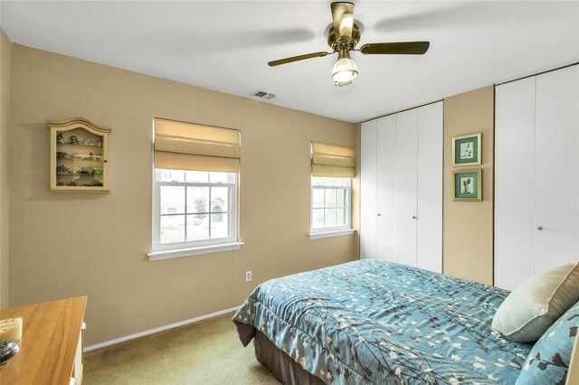 82 Harbour Ln, Bay Shore, NY 11706 - bedroom featuring carpet, two closets, and a ceiling fan