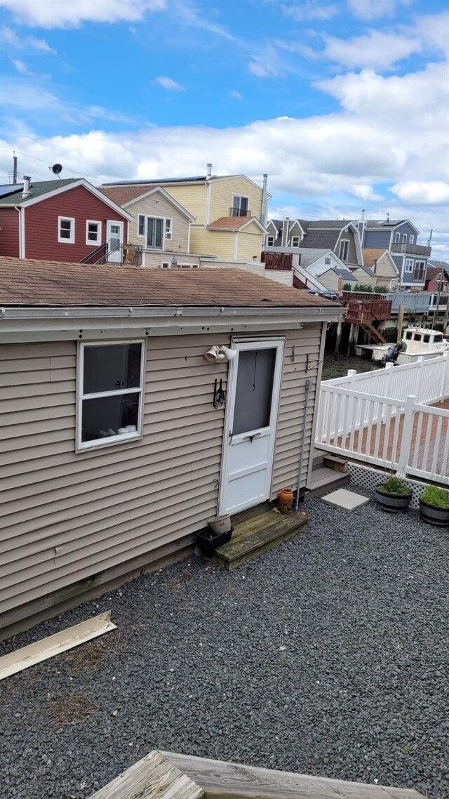 10 W 15th Rd, Broad Channel, NY 11693 - rear view of house with a residential view and an outdoor structure