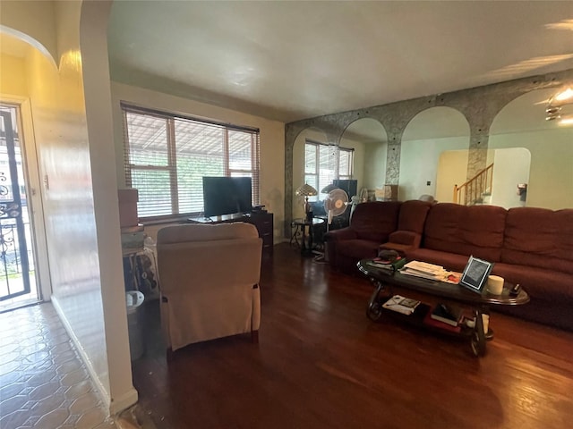 1037 E 214th St, Bronx, NY 10469 - living area featuring arched walkways, stairway, and wood finished floors
