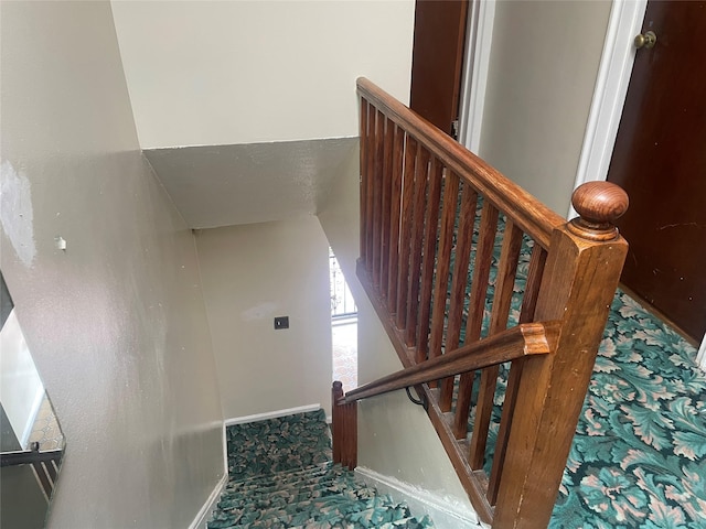 1037 E 214th St, Bronx, NY 10469 - stairway featuring carpet floors and baseboards