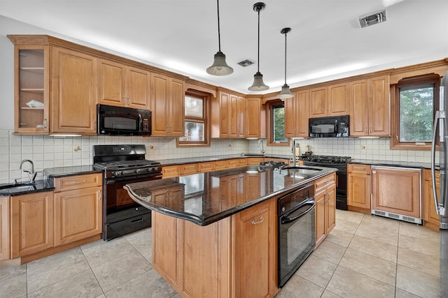 15 Dr Frank Rd, Spring Valley, NY 10977 - kitchen featuring black appliances, dark stone counters, healthy amount of natural light, and light tile patterned floors