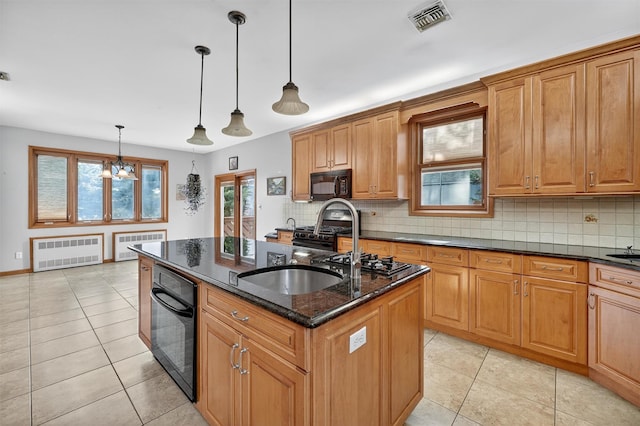 15 Dr Frank Rd, Spring Valley, NY 10977 - kitchen with black appliances, radiator, a center island with sink, and backsplash