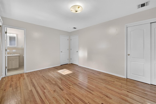 15 Dr Frank Rd, Spring Valley, NY 10977 - unfurnished bedroom featuring light wood-type flooring and ensuite bathroom