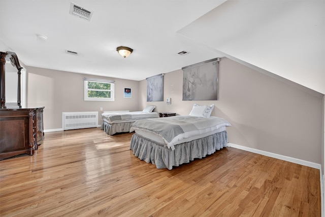 15 Dr Frank Rd, Spring Valley, NY 10977 - bedroom with radiator heating unit and light wood-type flooring