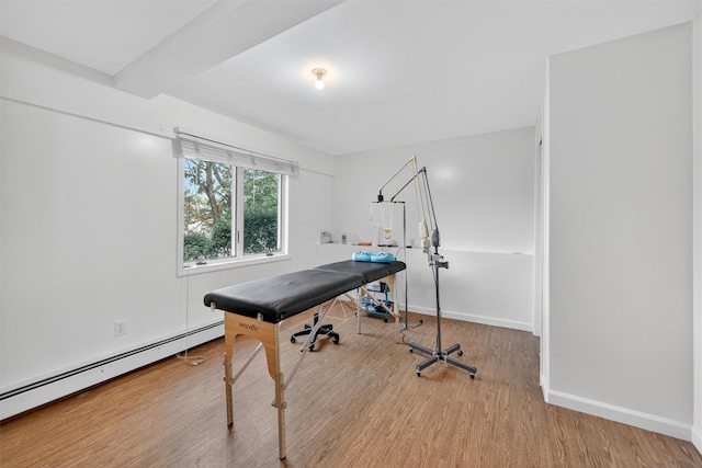 15 Dr Frank Rd, Spring Valley, NY 10977 - office space with a baseboard heating unit and wood finished floors