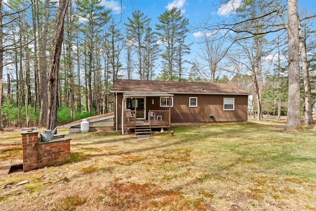 22 Bodine Lake Rd, Call Listing Agent, NY 12792 - rear view of property featuring a wooden deck and a yard