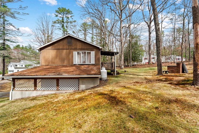 22 Bodine Lake Rd, Call Listing Agent, NY 12792 - view of side of home featuring a lawn