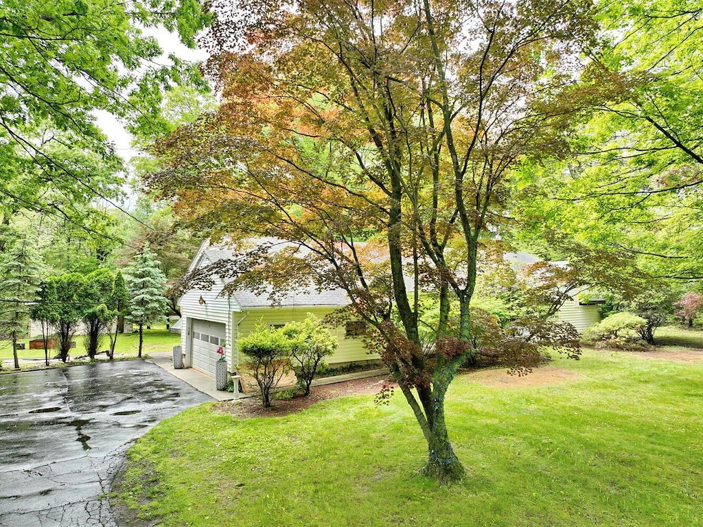 33-33A Wilder Rd, Monsey, NY 10952 - view of front of house with driveway and a front lawn