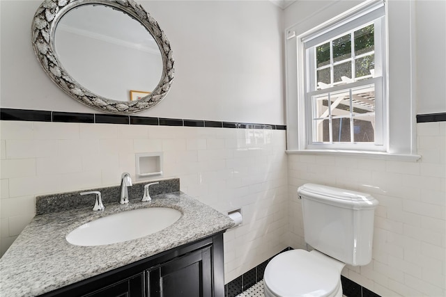 66 Riverview Rd, Irvington, NY 10533 - half bath featuring tile walls, vanity, toilet, and wainscoting