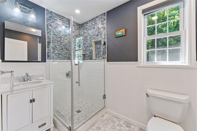 66 Riverview Rd, Irvington, NY 10533 - bathroom featuring a shower stall, vanity, toilet, a wainscoted wall, and tile patterned flooring