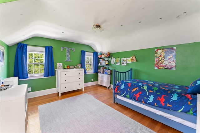 66 Riverview Rd, Irvington, NY 10533 - bedroom featuring lofted ceiling, multiple windows, wood finished floors, and baseboards