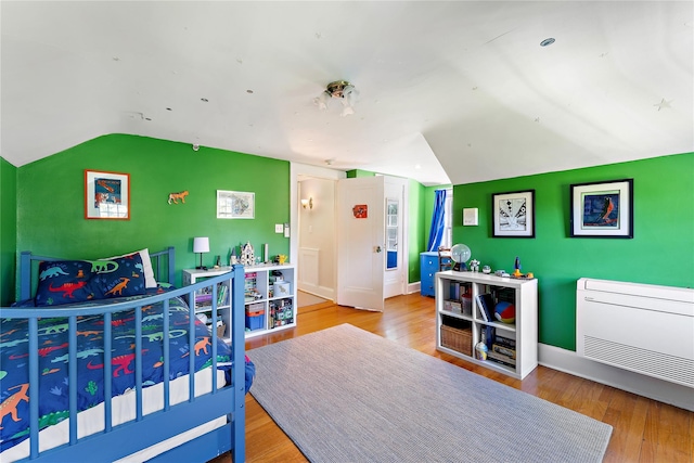 66 Riverview Rd, Irvington, NY 10533 - bedroom featuring vaulted ceiling, wood finished floors, and baseboards