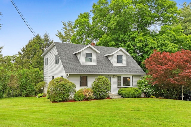 571 Farm To Market Rd, Brewster, NY 10509 - cape cod house featuring a chimney, roof with shingles, and a front lawn