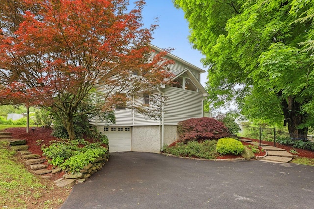 571 Farm To Market Rd, Brewster, NY 10509 - view of property exterior featuring asphalt driveway and an attached garage