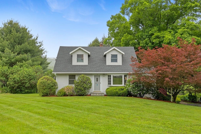 571 Farm To Market Rd, Brewster, NY 10509 - cape cod-style house featuring a front lawn, a chimney, and a shingled roof