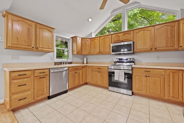 571 Farm To Market Rd, Brewster, NY 10509 - kitchen with appliances with stainless steel finishes, lofted ceiling, a sink, healthy amount of natural light, and light countertops