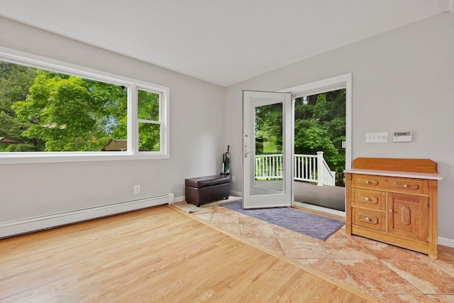 571 Farm To Market Rd, Brewster, NY 10509 - doorway to outside with baseboards, a baseboard heating unit, and wood finished floors