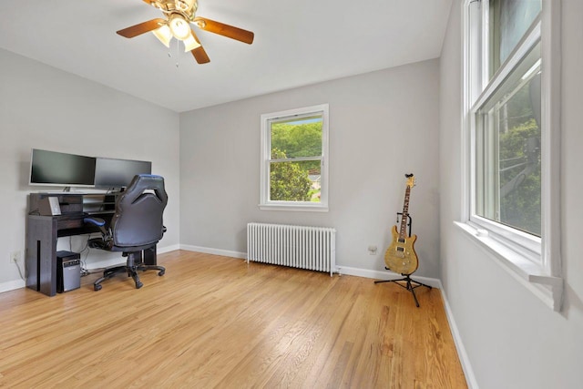 571 Farm To Market Rd, Brewster, NY 10509 - home office featuring radiator, wood finished floors, baseboards, and a ceiling fan