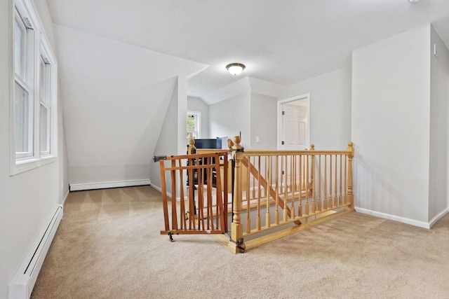 571 Farm To Market Rd, Brewster, NY 10509 - hallway with an upstairs landing, a baseboard heating unit, carpet flooring, baseboard heating, and lofted ceiling