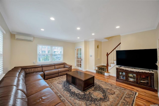 21-89 47th St, Long Island City, NY 11105 - living room with a wall mounted air conditioner, ornamental molding, wood finished floors, stairway, and recessed lighting