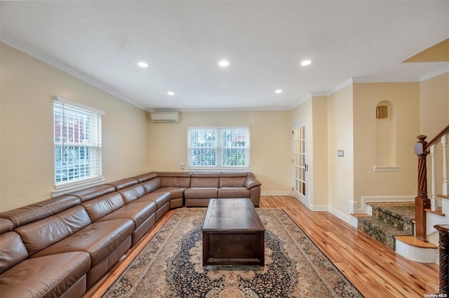 21-89 47th St, Long Island City, NY 11105 - living room with light wood-type flooring, recessed lighting, crown molding, stairway, and an AC wall unit