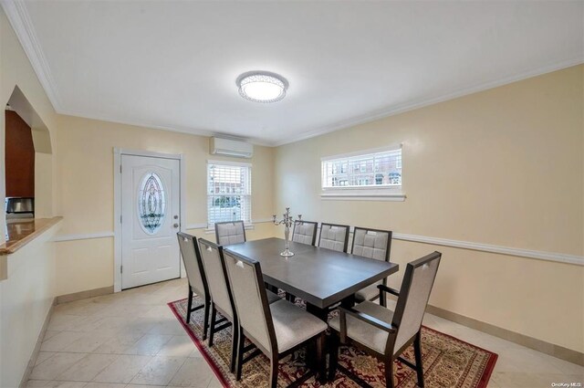 21-89 47th St, Long Island City, NY 11105 - dining space featuring a wall mounted air conditioner, crown molding, baseboards, and light tile patterned floors
