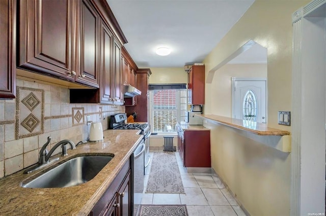 21-89 47th St, Long Island City, NY 11105 - kitchen with a sink, under cabinet range hood, backsplash, light tile patterned flooring, and light stone countertops