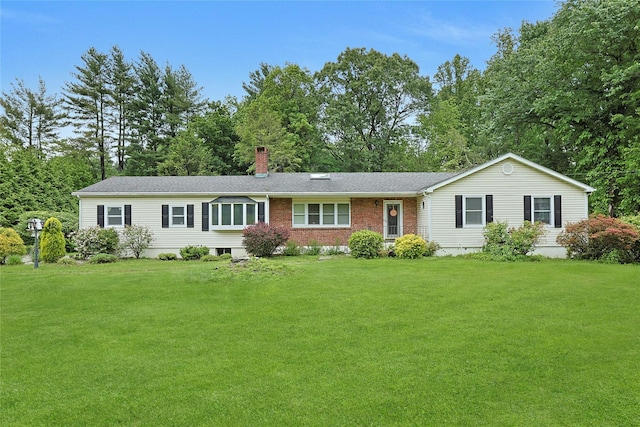 19 Leicester Rd, Briarcliff Manor, NY 10510 - single story home with a chimney, a front yard, and view of scattered trees