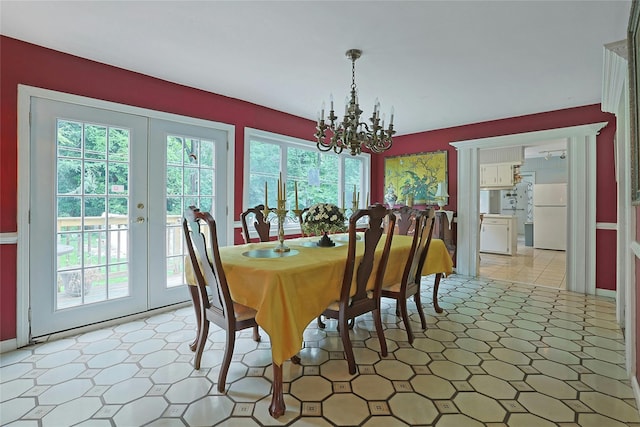 19 Leicester Rd, Briarcliff Manor, NY 10510 - dining room with a chandelier, french doors, and light floors