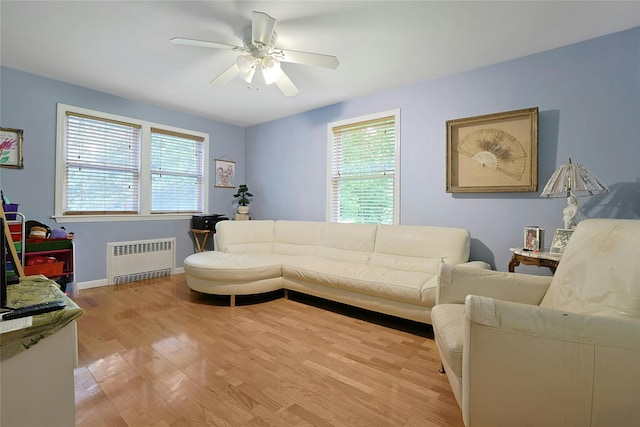 19 Leicester Rd, Briarcliff Manor, NY 10510 - living area with radiator heating unit, plenty of natural light, a ceiling fan, and light wood-type flooring