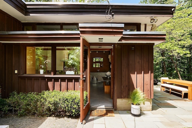 100 Old Pascack Rd, Pearl River, NY 10965 - doorway to property featuring board and batten siding
