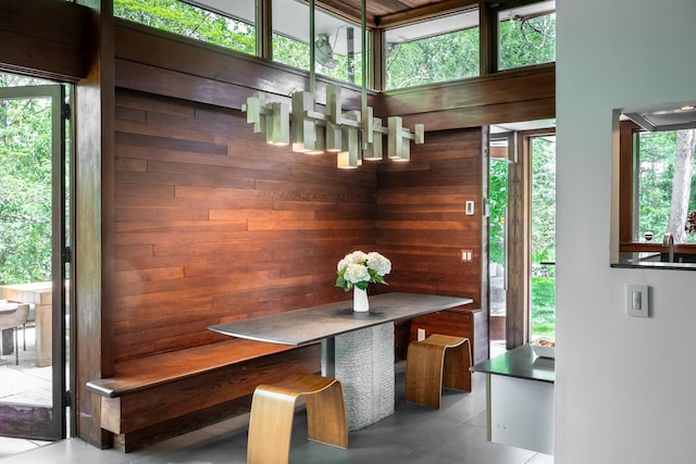 100 Old Pascack Rd, Pearl River, NY 10965 - dining room featuring wooden walls and tile patterned floors