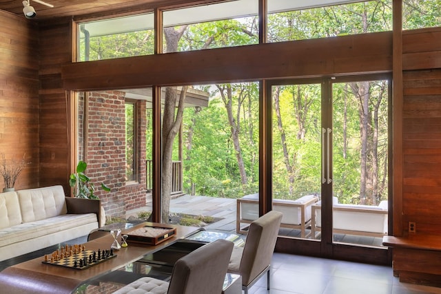 100 Old Pascack Rd, Pearl River, NY 10965 - dining space with wooden walls and tile patterned flooring
