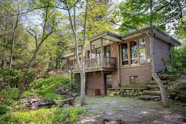 100 Old Pascack Rd, Pearl River, NY 10965 - back of house featuring brick siding and a patio area