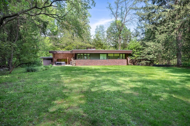 100 Old Pascack Rd, Pearl River, NY 10965 - back of property with a lawn and brick siding