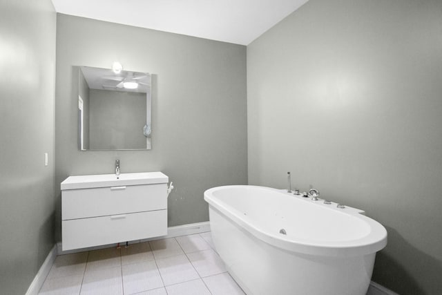 87 Horton Dr, Monsey, NY 10952 - bathroom with a freestanding tub, baseboards, vanity, and tile patterned floors