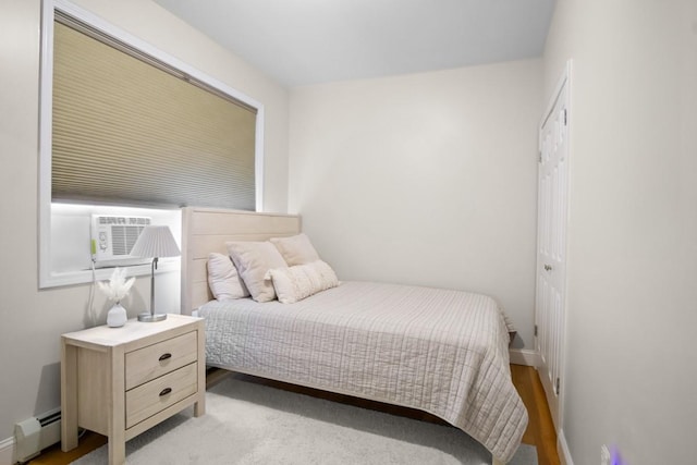 87 Horton Dr, Monsey, NY 10952 - bedroom featuring a baseboard radiator, cooling unit, and baseboards