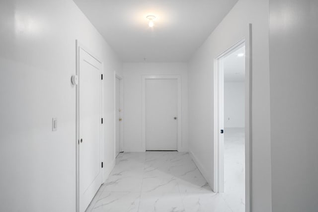 87 Horton Dr, Monsey, NY 10952 - hallway featuring light marble finish flooring and baseboards