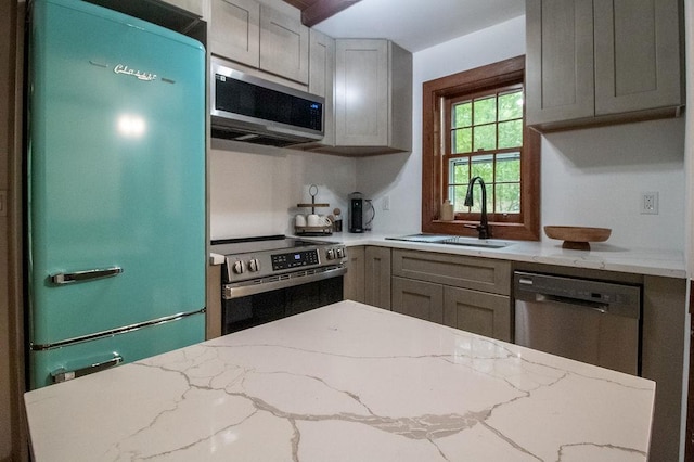 22 Mount Laurel Rd, Greenfield Park, NY 12435 - kitchen featuring stainless steel appliances, a sink, and light stone countertops