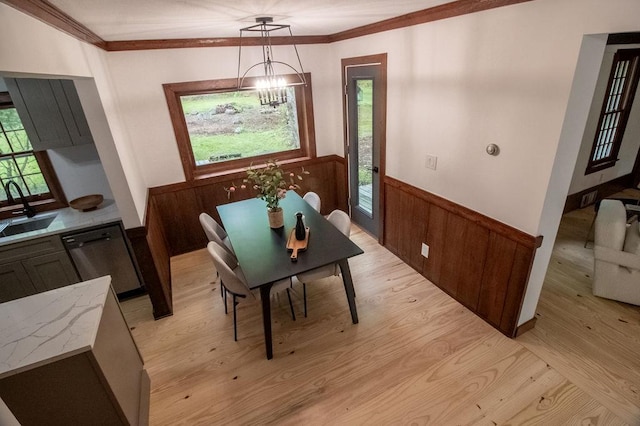 22 Mount Laurel Rd, Greenfield Park, NY 12435 - dining area with a wainscoted wall, light wood-style floors, a chandelier, plenty of natural light, and ornamental molding